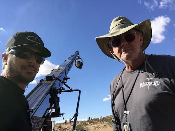 Crew operating crane on set