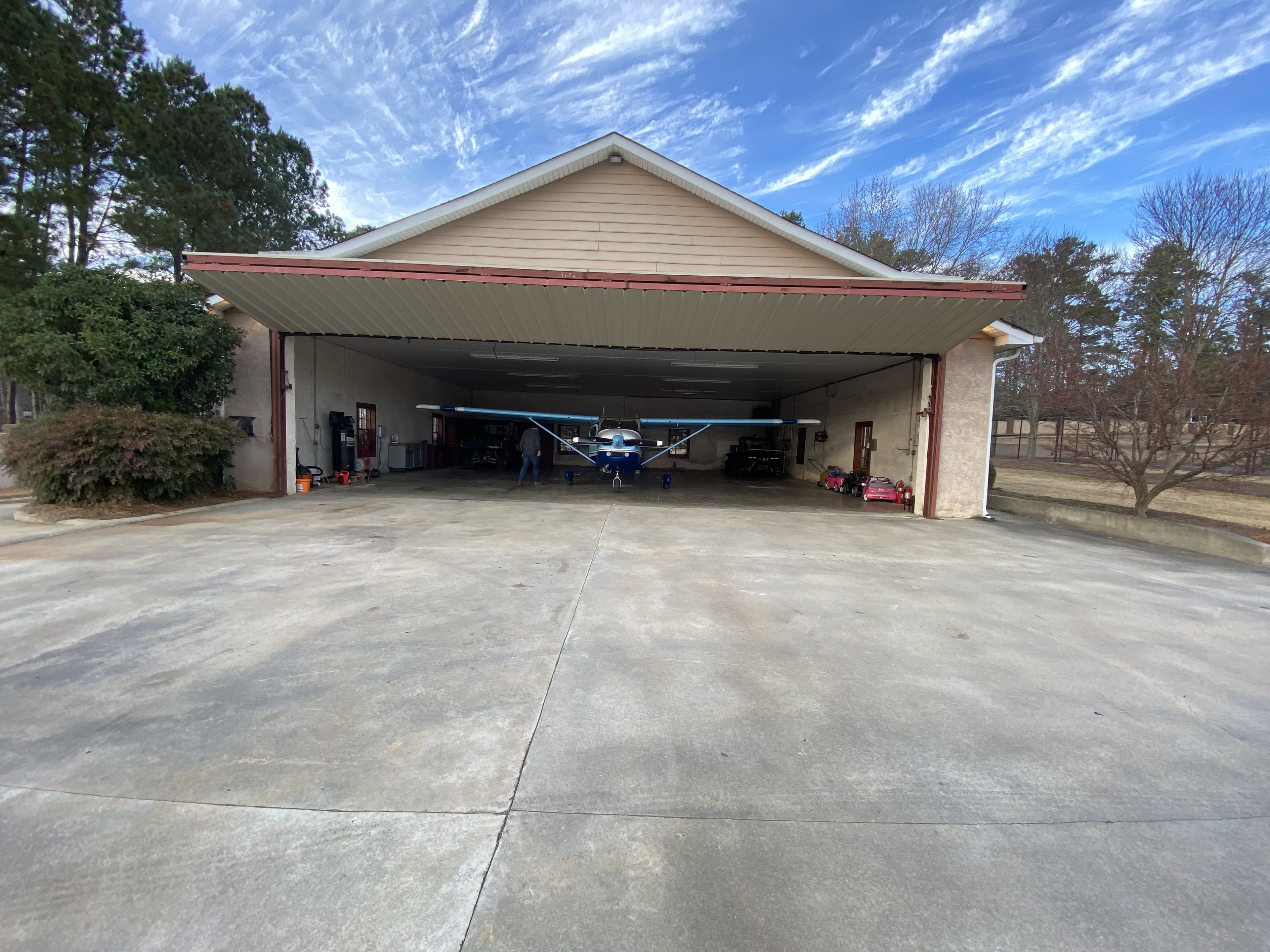 Hangar open with plane inside