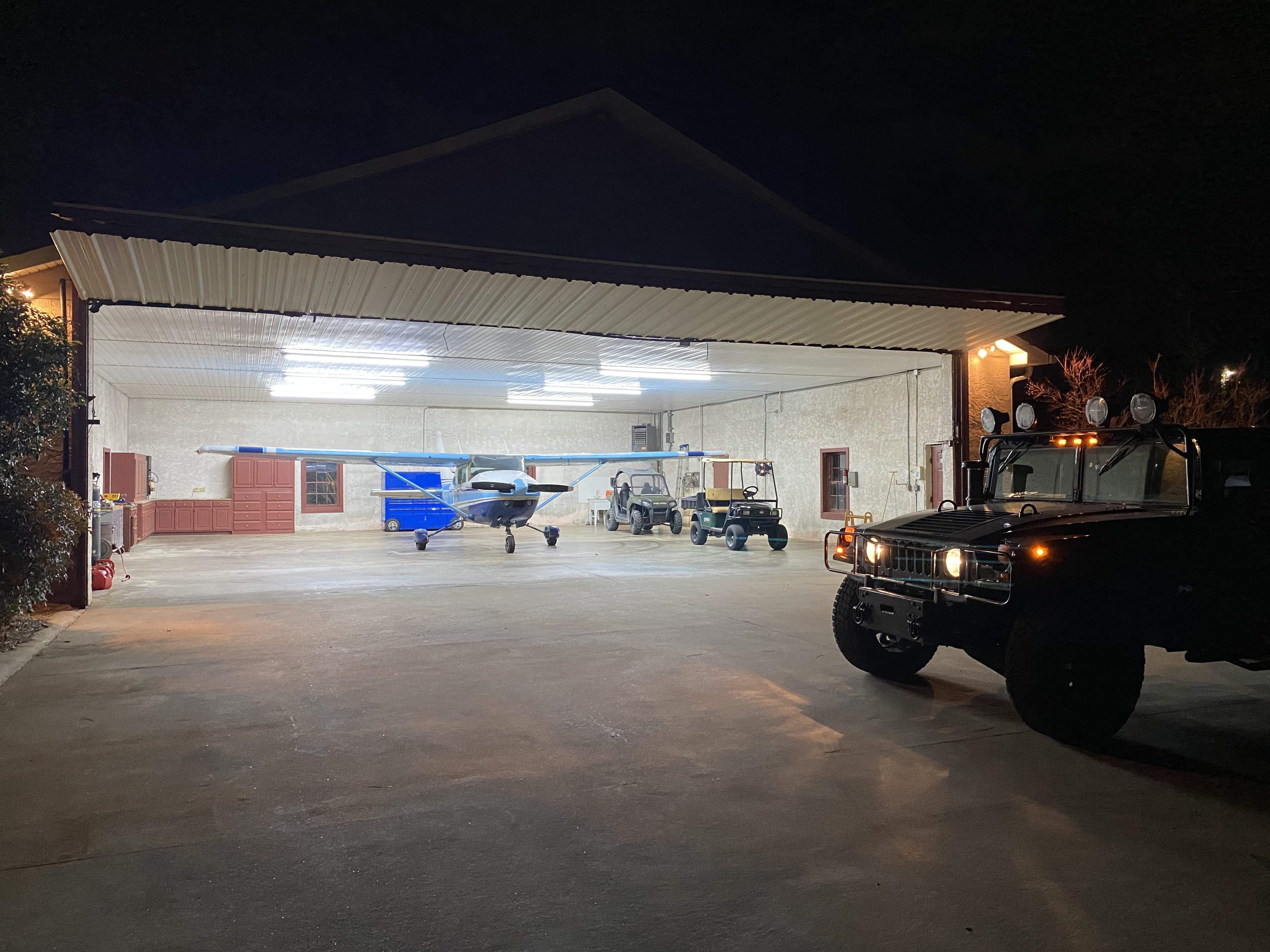 Hangar at night with aircraft